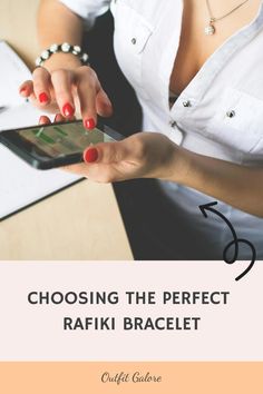 Person with red nail polish browsing a smartphone in an office setting. Text reads: "Choosing the Perfect Rafiki Bracelet." Bracelets Outfit, Formal Dress Code, Best Style, Developing Country