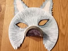 a paper mache mask with an animal's face cut out