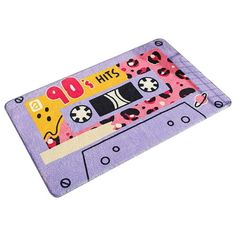 a purple rug with an image of a cassette tape on it's side and the words, 40 hits