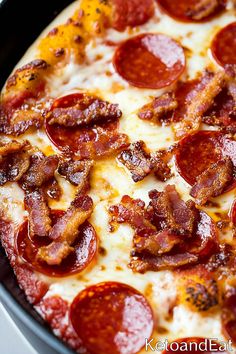 a pepperoni pizza with cheese and bacon on the top is ready to be eaten