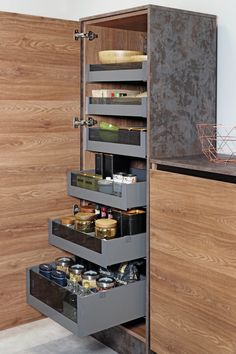 an open cabinet with drawers in the middle