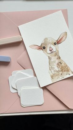 a card with an animal on it next to some crafting supplies