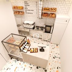 an aerial view of a bakery with donuts and pastries