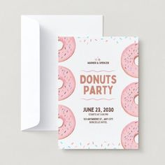 a pink donut party card with sprinkles on it