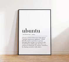 a black and white poster with the words ubuntu on it in an empty room