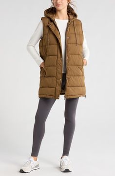 "Find ZELLA Long Hooded Puffer Vest on Editorialist. Add an extra layer of warmth to your wardrobe with this water-resistant puffer vest in a longline silhouette meant to keep your core cozy on cool-weather days. 32\" length (size Medium) Front zip closure with snap storm flap Drawstring hood Front welt pockets Side zip vents Lined, with 100% recycled polyester fill 100% polyester Machine wash, tumble dry Imported" Womens Long Puffer Vest, Long Puffer Vest, Hooded Puffer Vest, Long Puffer, Weather Day, Puffer Vest, Long A Line, Welt Pockets, Welt Pocket