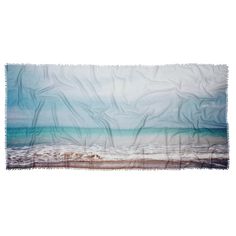 an ocean scene with waves crashing on the beach