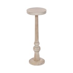 a small white wooden table with a round top and two columns on the base,