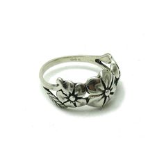 Stylish sterling silver ring, flower band 925/1000. Stamped 925. Approximate weight 3.3 grams. Top width 1.1 cm All our jewels are made from solid sterling silver 925/1000 and are carefully crafted by hand in our family workshop. We dispatch your orders in 5 working days, worldwide and the postage is $5. We ship registered priority mail. Please allow 5-7 working days for delivery in Europe and 10-15 working days outside Europe. For any questions - please do not hesitate to contact me! Flower Shaped Hallmarked Rings For Anniversary, Flower Shaped Hallmarked Anniversary Ring, Silver Flower Ring Stamped 925, Silver Flower Ring In Sterling Silver Stamped 925, Hallmarked Sterling Silver Flower Ring, Hallmarked Silver Flower Ring, White Gold Flower Ring Stamped 925, Classic Silver Hallmarked Flower Ring, Silver Flower Rings With Adjustable Fit