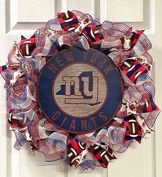 a new york giants wreath hanging on the front door