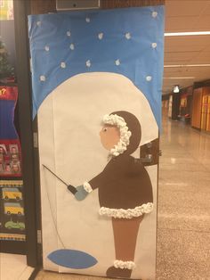 a paper cut out of a woman holding a golf club in front of a door