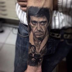 a man's arm with a portrait of him on it and the words,