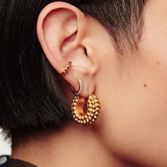 Lava Hoop Earrings – a symbol of sophistication for the modern woman. Crafted with volcanic elegance, these hoops radiate a unique blend of strength and grace. Metal: 14K Gold Vermeil Hoop Dimensions: 23 mm / 0.91" x 9 mm / 0.35" Weight: 18 g Gold Plated Tarnish Resistant Hoop Ear Cuff, Gold Plated Hoop Ear Cuff Tarnish Resistant, Tarnish Resistant Gold-plated Hoop Ear Cuff, 14k Gold Hoop Ear Cuff, Elegant Pierced Hoop Ear Cuff, Elegant Hoop Style Pierced Ear Cuff, Fine Jewelry Hoop Earrings With Plating, Fine Jewelry Plated Hoop Earrings, Gold Plated Hoop Ear Cuff For Pierced Ears