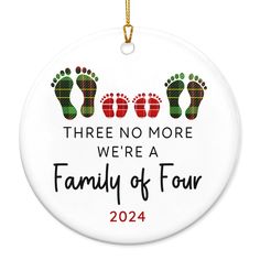 a christmas ornament that says three no more were a family of four