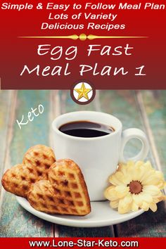 a cup of coffee and some heart shaped waffles on a plate with the words egg fast meal plan 1