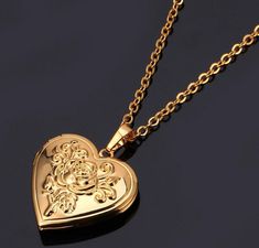 If it's heart shaped, we want it. Especially, if it's this romantic heart shaped locket necklace with a pretty embossed rose on it. Oooh, and it opens to so you can put your sweethearts photo in it or leave a secret message! *wink*   Pendant Size: 25MM*31MM .90 inch * 1.22 inch  Length: 46cm+5cm/adjustable 18.11 inch +1.96 inch/adjustable    Special Order Item: Will ship in about 2-4 weeks from purchase. Memory Jewelry, Heart Shaped Locket, Gold Locket Necklace, Necklace Chain Types, Gold Roses, Memorial Pendant, Romantic Jewelry, Heart Locket Necklace, Locket Pendant Necklace