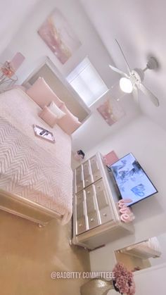 an aerial view of a bedroom with a bed and ceiling fan