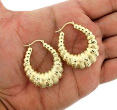 "ITEM DESCRIPTION Beautiful New 10K Yellow Gold 8mm Scalloped Hoop Earrings - Oval Shrimp Door Knocker Women Product Features: 100% Authentic 10KT Gold Ships within 1 business day Premium workmanship Diamond-Cut Finish Custom made designs  Brand New 10KT stamp on the bail/loop Length: 45mm(1.75\" inches) Width: 8mm Weight: 5.4-5.6 Grams Gift box included Country of Manufacture - Italy It comes with a Beautiful Gift Box SHIPPING & RETURN POLICY FREE SHIPPING IN THE USA We Offer 30 Days Refund & Exchange Policy To view our entire collection of 10K/14K/ Sterling Silver jewelry, please visit my storefront here: https://www.etsy.com/shop/JewelzWorld?ref=simple-shop-header-name&listing_id=1021486544 Check out our Beautiful 10K/14K Chains Collections https://www.etsy.com/shop/JewelzWorld?ref=simp Shrimp Earrings, Earrings Gold Hoops, Earrings Hoop, Door Knocker, Gold Hoops, Jewelry Earrings Hoops, Beautiful Gift Boxes, Gold Hoop Earrings, 10k Gold