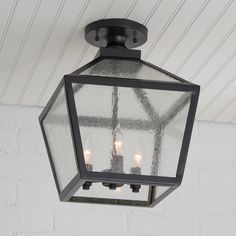 an outdoor light hanging from the ceiling