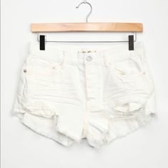 Free People White High-Rise Distressed Denim Shorts Size 27 New With Tag 100% Cotton. Machine Wash Cold. Imported. White Distressed Mid-rise Bottoms, White Distressed Short Bottoms, White High-rise Distressed Jean Shorts, White Distressed High-waisted Shorts, White Distressed Cutoff Bottoms, White Ripped Cutoff Bottoms, White Cutoff Jean Shorts With Pockets, Summer White Washed Bottoms, High Rise White Jeans