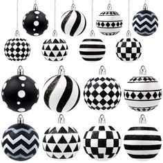 black and white ornaments hanging from chains on a white background, all decorated in geometric patterns