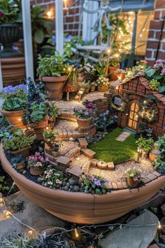 A fairy garden is a tiny, magical landscape crafted with miniature plants, decorations, and accessories in containers or outdoor areas. People create them for fun and relaxation, as they offer a creative outlet and a break from daily stresses. This post lists 29 different ideas for your fairy garden. Small, DIY, homemade, outdoor, large, kids, party, indoor, dollar tree, indoor easy, easy, enchanted forest. Plant Decoration Outdoor Garden Ideas, Making Fairy Garden Accessories, Fairy Garden In Backyard, Moss And Fern Garden, Fairy Garden Outside, Elf Garden Ideas, Fairy Cottage Garden, Fairy House Inspiration, Magical Small Garden