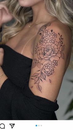 a woman with a flower tattoo on her shoulder