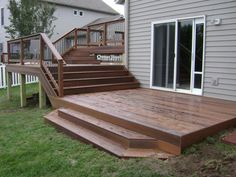 a wooden deck with steps leading up to it