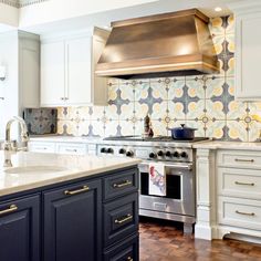 a kitchen with an oven, stove and counter tops in white painted wood flooring