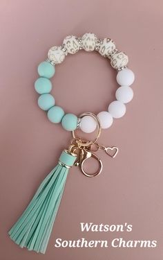 This STRETCHY Gold Leopard Wristlet Keychain with Mint Green & White silicone beads makes a great gift or just keep it for yourself!  These are hand made using 100% Food Grade Silicone Beads (Non-Toxic). You will receive 1 Wristlet keychain exactly like the picture. Each Wristlet Keychain comes with a total of 15 beads, but I am happy to add 1 extra bead if needed, at no additional cost. These are hand made using 100% Food Grade Silicone Beads (Non-Toxic). These are made with elastic cord so the Silicone Bead Ideas, Wristlet Keychains, Beaded Wristlet, Christmas Bracelet, Wristlet Keychain, Beaded Keychains, Silicone Beads, Beads Jewelry, Food Grade Silicone