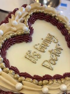 a heart shaped cake with the words happy birthday written on it