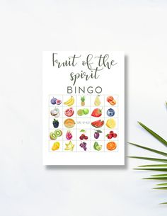 the fruit of the spirit book next to a palm leaf