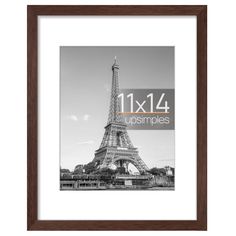 the eiffel tower in black and white with orange lettering that reads 11x4