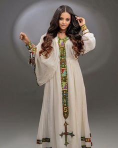 Simple habesha dress Traditional Long Dresses For Transitional Season, Traditional Multicolor Long Sleeve Maxi Dress, Traditional Tunic Dresses For Navratri, Multicolor Long Dress For Traditional Ceremonies, Traditional Long Sleeve Maxi Dress For Transitional Season, Traditional Long Sleeve Transitional Maxi Dress, Traditional Tunic Dresses For Festivals, Traditional Long Multicolor Dresses, Multicolor Long Dresses With Traditional Patterns