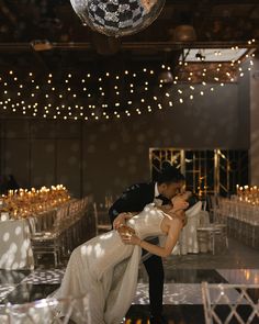 a bride and groom dance at their wedding reception