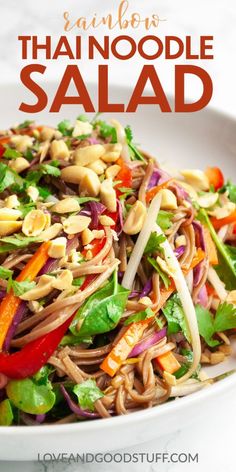 a white bowl filled with noodles and vegetables