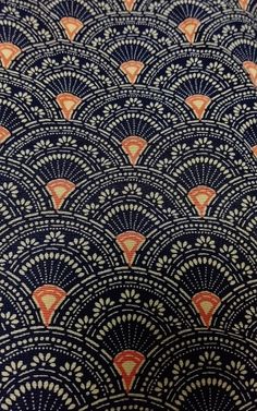 an image of a blue and orange fabric with fan design on the side, as well as