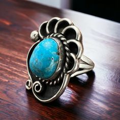 Turquoise ring - beautiful large cabochon on shadow box style base - Size 6 This stunning Turquoise ring features a large, beautiful cabochon set atop a unique shadow box style base. Perfect for size 6 fingers. Clearance item sales are final. Turquoise Cabochon Ring Jewelry, Unique Turquoise Ring Jewelry, Collectible Turquoise Jewelry With Large Stone, Antique Untreated Turquoise Jewelry, Elegant Collectible Cabochon Turquoise Ring, Unique Turquoise Ring With Large Round Stone, Turquoise Oval Cabochon Ring With Large Stone, Artisan Turquoise Cabochon Ring, Turquoise Oval Jewelry With Large Stone