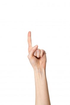 a person holding up their hand in the air with one finger and two fingers raised