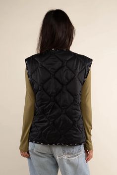 Reversible boxy quilted vest with contrast binding and side pockets. Reverse side is a 100% Rayon ditsy print. This garment is quilted in Los Angeles with 4oz poly-fill. *Side pockets are only on the Self (Black Nylon) side. Reversible side (Black Print) does not have side pockets. *All sale items are final sale* Made in United States Fabric: Self: 100% Nylon Lining : 100 % Rayon Hand wash Ditsy Print, Reversible Vest, Quilted Vest, Scarf Men, Mens Skin Care, Black Nylon, Black Nylons, Ugly Sweater, Black Print