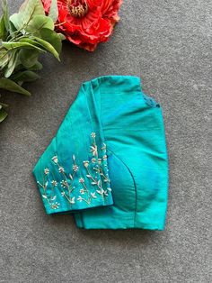 Hand embroidered ready made saree blouse / crop top/stitched saree blouse usa / sea green saree blouse/ hand embroidered blouse/zardosi blouse/sea green saree high neck blouse/green pure silk blouse/blue maggam work blouse        It is very true that a perfect blouse is the one which makes your saree look stand out !! If you find one of such a style that you have been wanting to have then dont let it go !! we carry such unique trending blouses that instantly add a stylish look to any saree !!     Well..!! we understand that you may not get in your desired size/pattern, here you go with customization according to your size/pattern which we can deliver in 1-2 weeks of time period !!      Here is a beautiful Hand embroidered saree blouse in mixed sea green color that has simple yet unique emb Zardosi Blouse, Sarees For Girls, Perfect Blouse, Hand Work Blouse, Maggam Work Blouses, High Neck Blouse, Designer Sarees Online, Green Saree, Aari Work