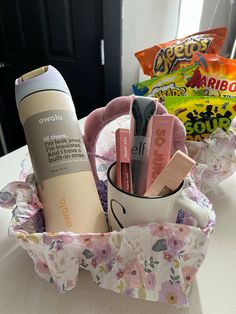 a cup filled with makeup and personal care items