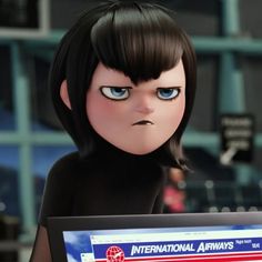 an animated doll holding a computer screen with the international airways logo on it's face