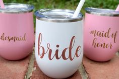 three bride tumblers with straws in them sitting on the ground next to each other