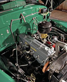 the engine compartment of an old green car