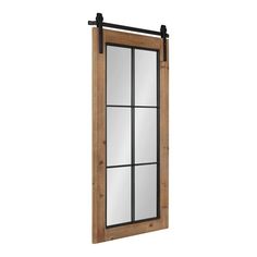 a wooden window with metal bars on the side