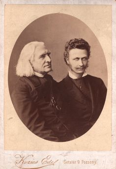 an old black and white photo of two people