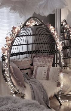 a bedroom with a bed, mirror and lights on the wall next to each other