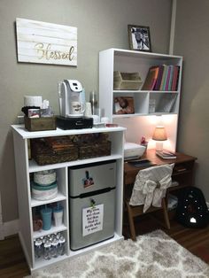 a white desk with drawers and shelves filled with items