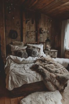 a bed in a room with wooden walls